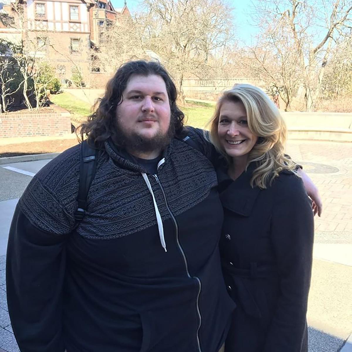 Photo of Christopher posing with a woman on 欧洲杯官方投注网站